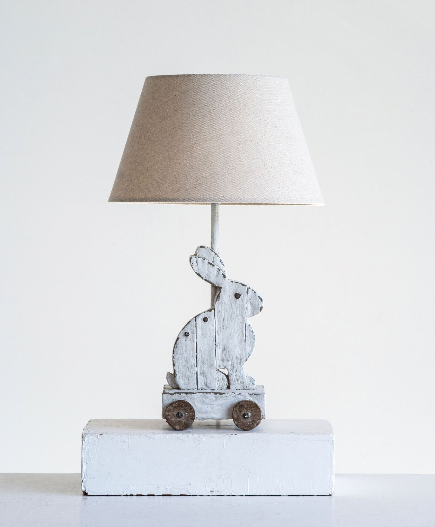 9-1/2" Round x 15-3/4"H Resin Rabbit Lamp on Wheels w/ Linen Shade, Antique White (40 Watt Bulb Maximum)